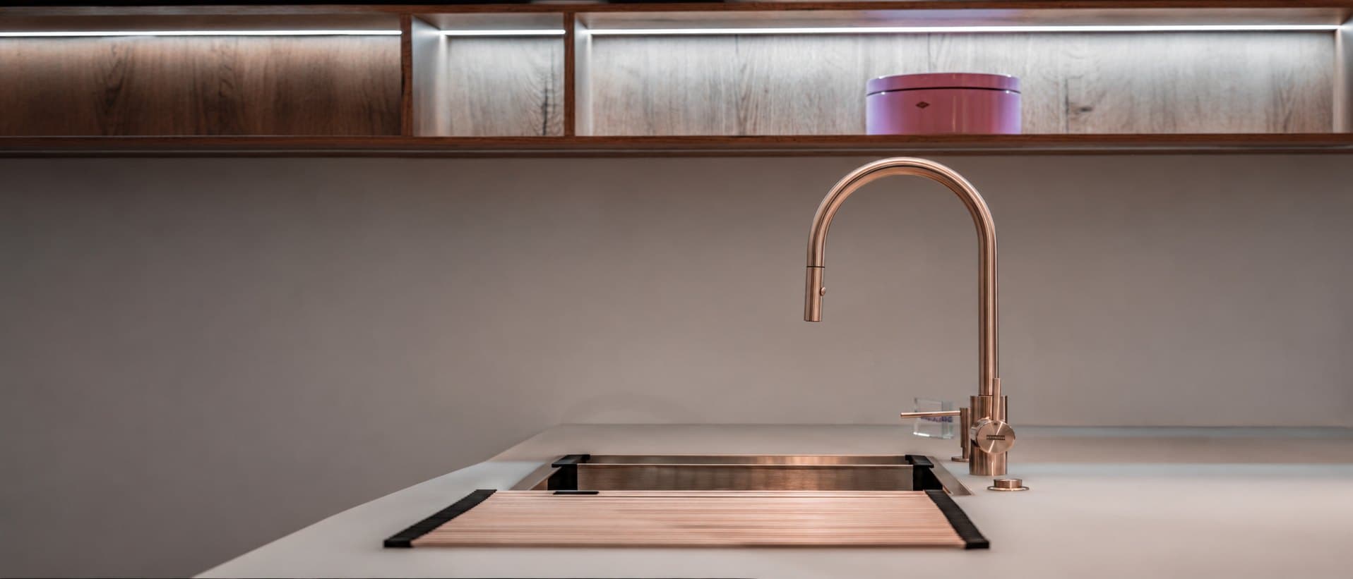 Copper tap and bespoke sink on a pale worktop