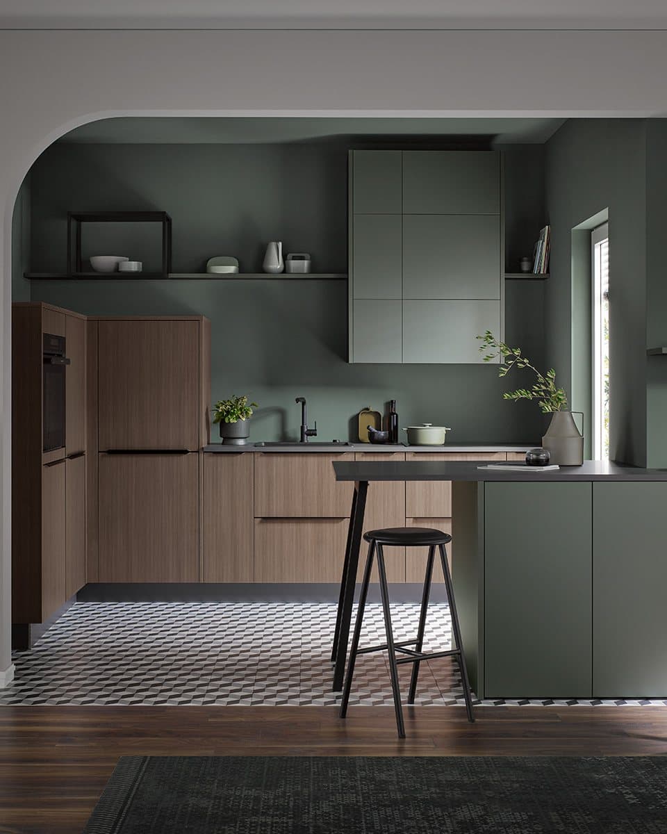 Metallic green and natural walnut kitchen, integrated worktop and storage